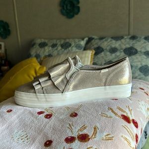 Triple deck keds glitter with fringe.